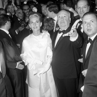 С Альфредом Хичкоком на Каннском кинофестивале 1963.