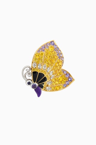 Брошь Petal de Papillon бриллианты сапфиры изумруды и гранаты. Один из лепестков оказывается еще одной брошью — бабочкой.