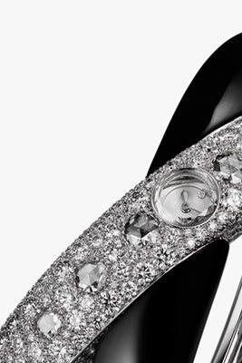 Часы Cartier Rings of Saturn с браслетом из двух перекрещивающихся колец с бриллиантами | Vogue