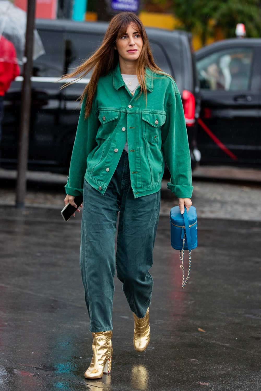 PARIS FRANCE  OCTOBER 01 Gala Gonzalez seen wearing green button shirt blue Chanel bag pants golden ankle boots outside...