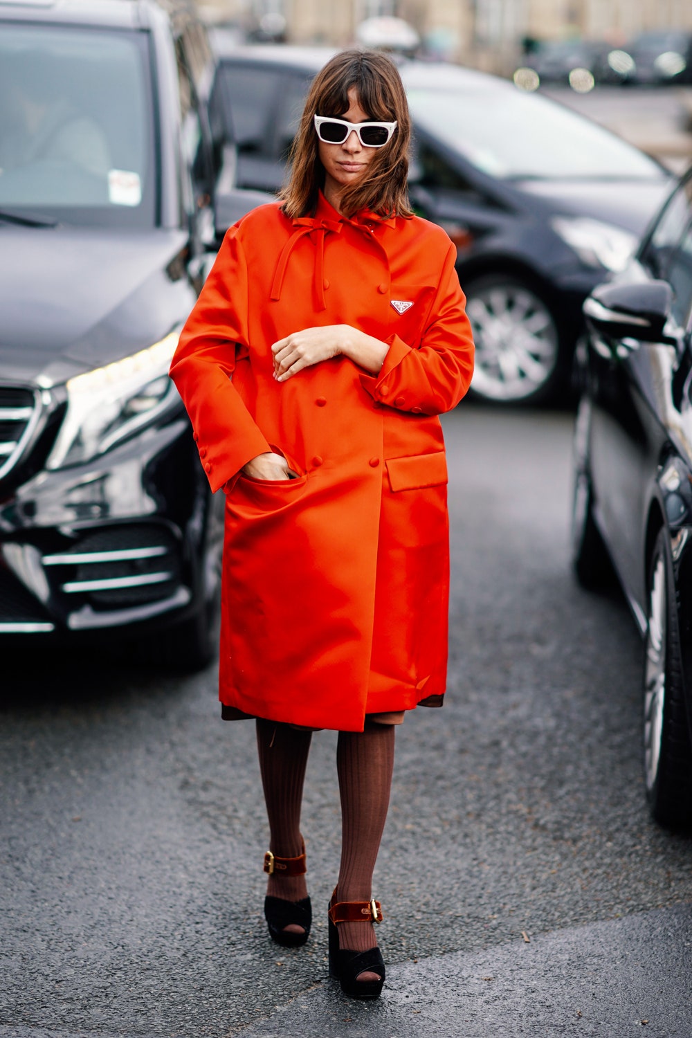 PARIS FRANCE  MARCH 05 Natasha Goldenberg wears an orange coat outside Miu Miu during Paris Fashion Week Womenswear...