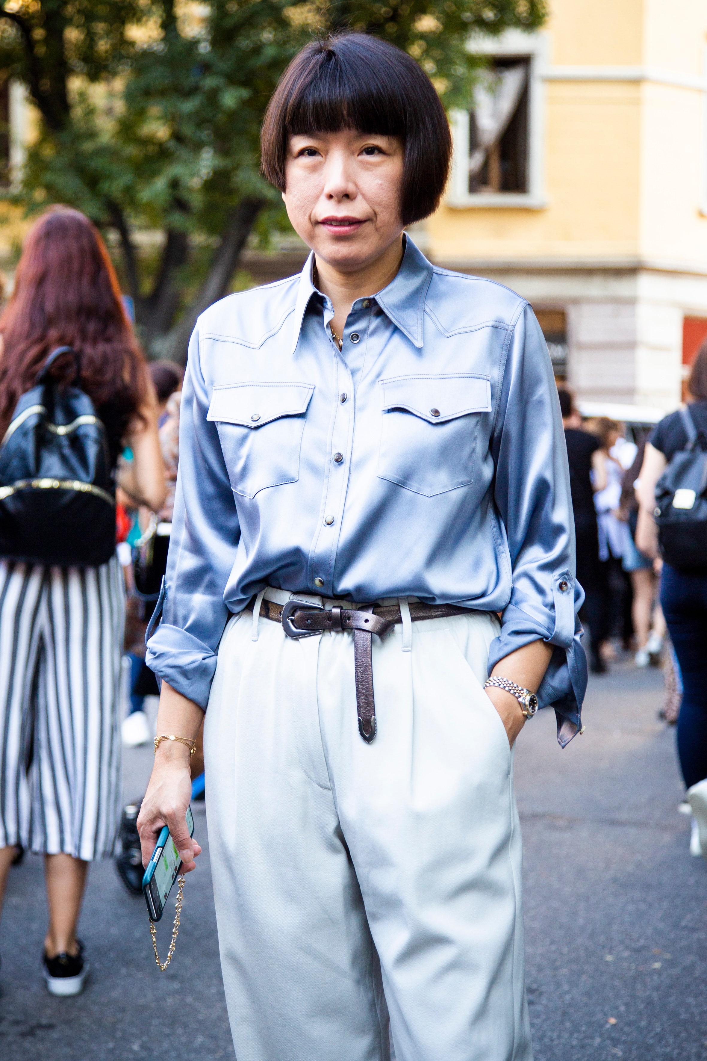 MILAN ITALY  SEPTEMBER 23   Angelica Cheung wearing light blue shirt and white pants is seen before the Giorgio Armani...