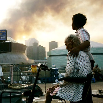 Citizens of New Orleans photographed on an overpass where they waited for days for evacuation following Hurricane...