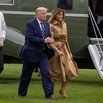 WASHINGTON DC  AUGUST 16 Barron Trump US President Donald Trump and First lady Melania Trump walk on the South Lawn of...