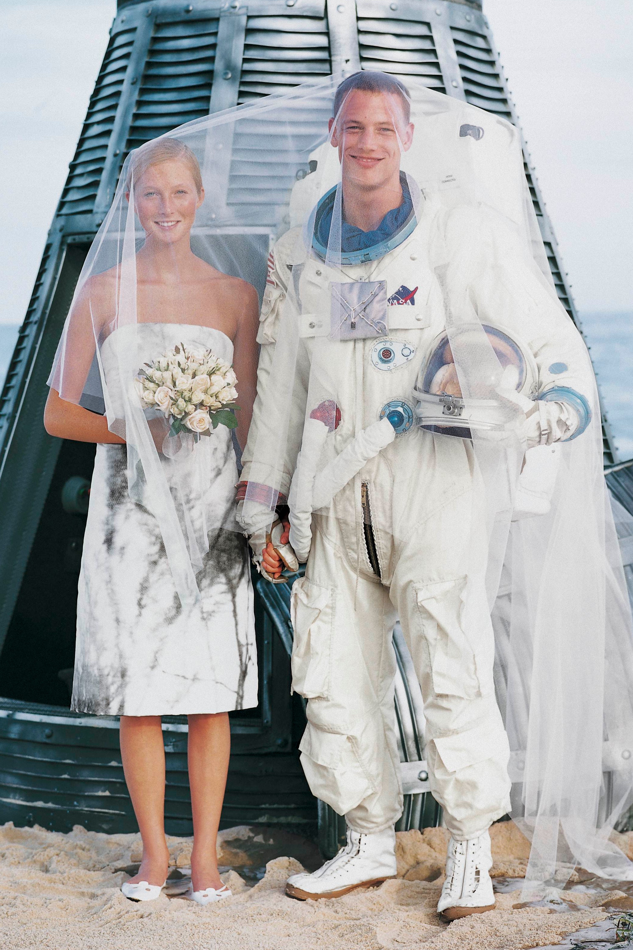 UNSPECIFIED  NOVEMBER 1  Model Maggie Rizer and US astronaut standing as bride and groom before a beached space capsule...