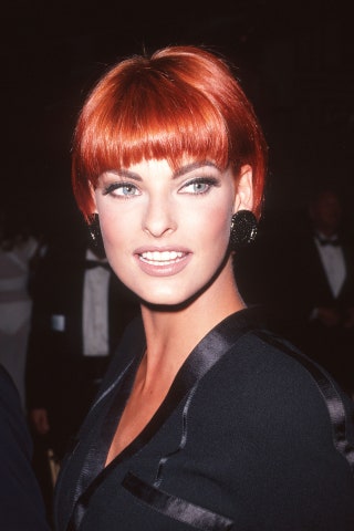 Image may contain Linda Evangelista Human Person Hair Face Fashion Premiere Suit Coat Clothing and Overcoat