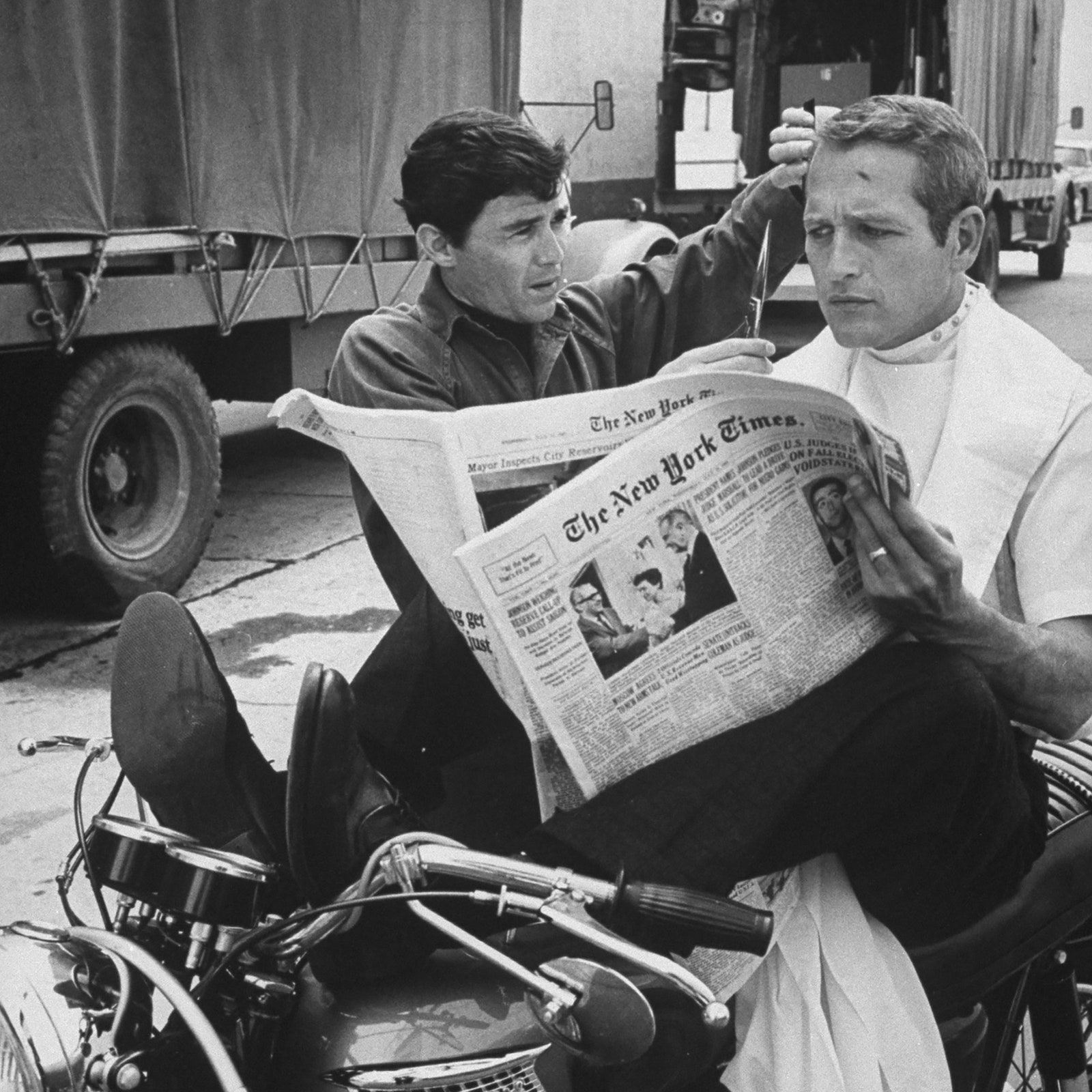 Image may contain Paul Newman Wheel Machine Human Person Text Newspaper and Book