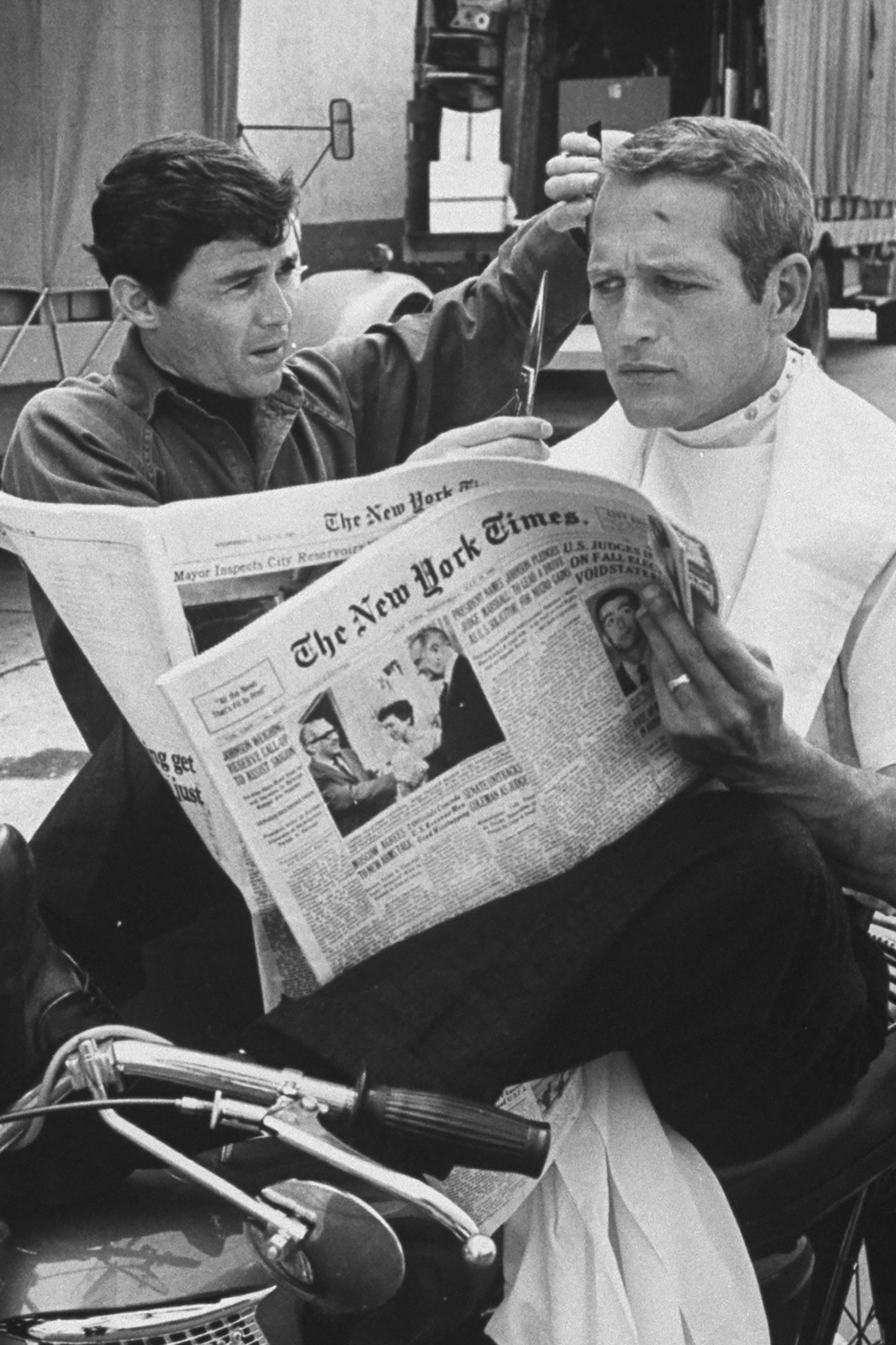 Image may contain Paul Newman Wheel Machine Human Person Text Newspaper and Book