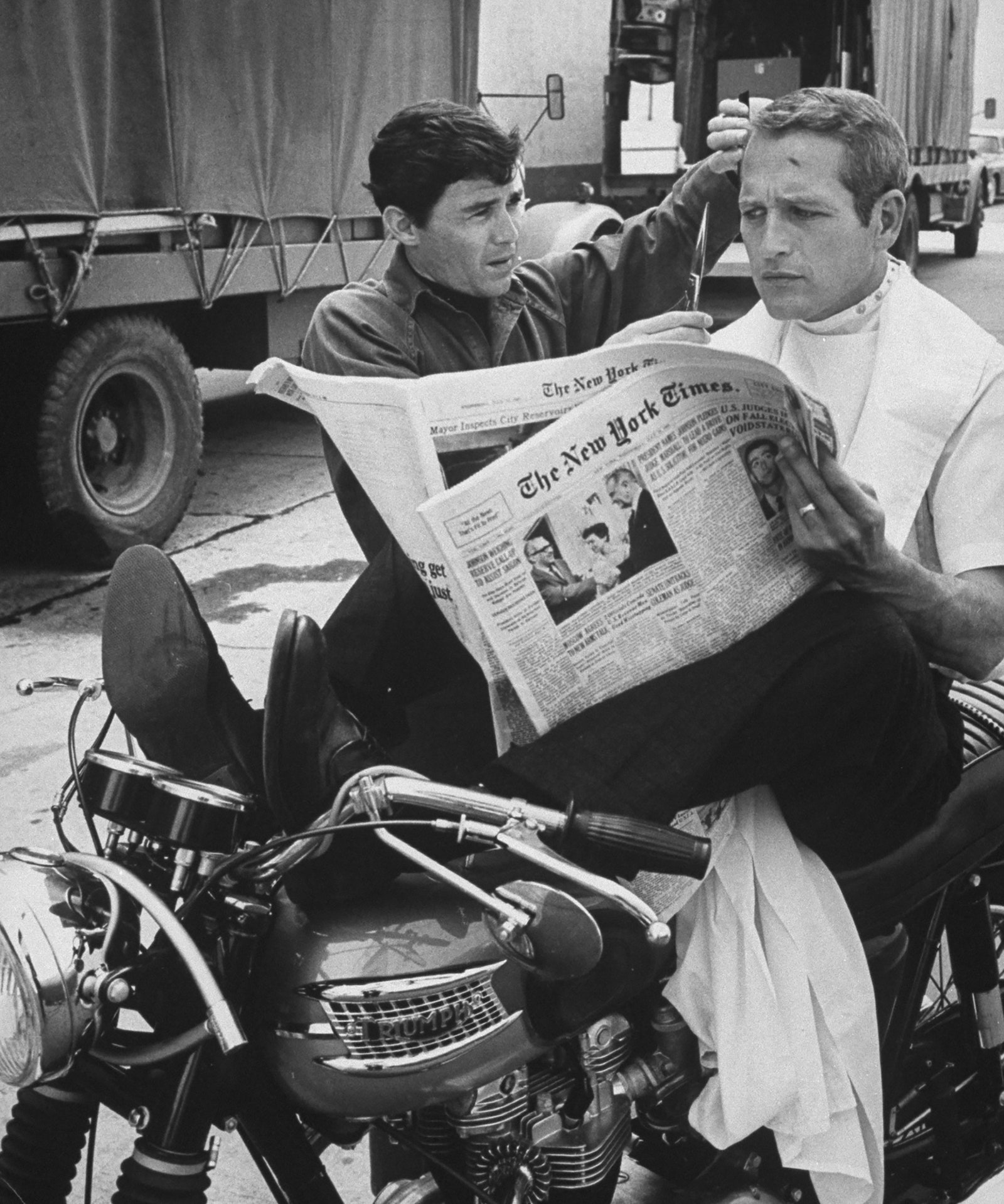 Image may contain Paul Newman Vehicle Transportation Motorcycle Human Person Wheel Machine Text and Newspaper