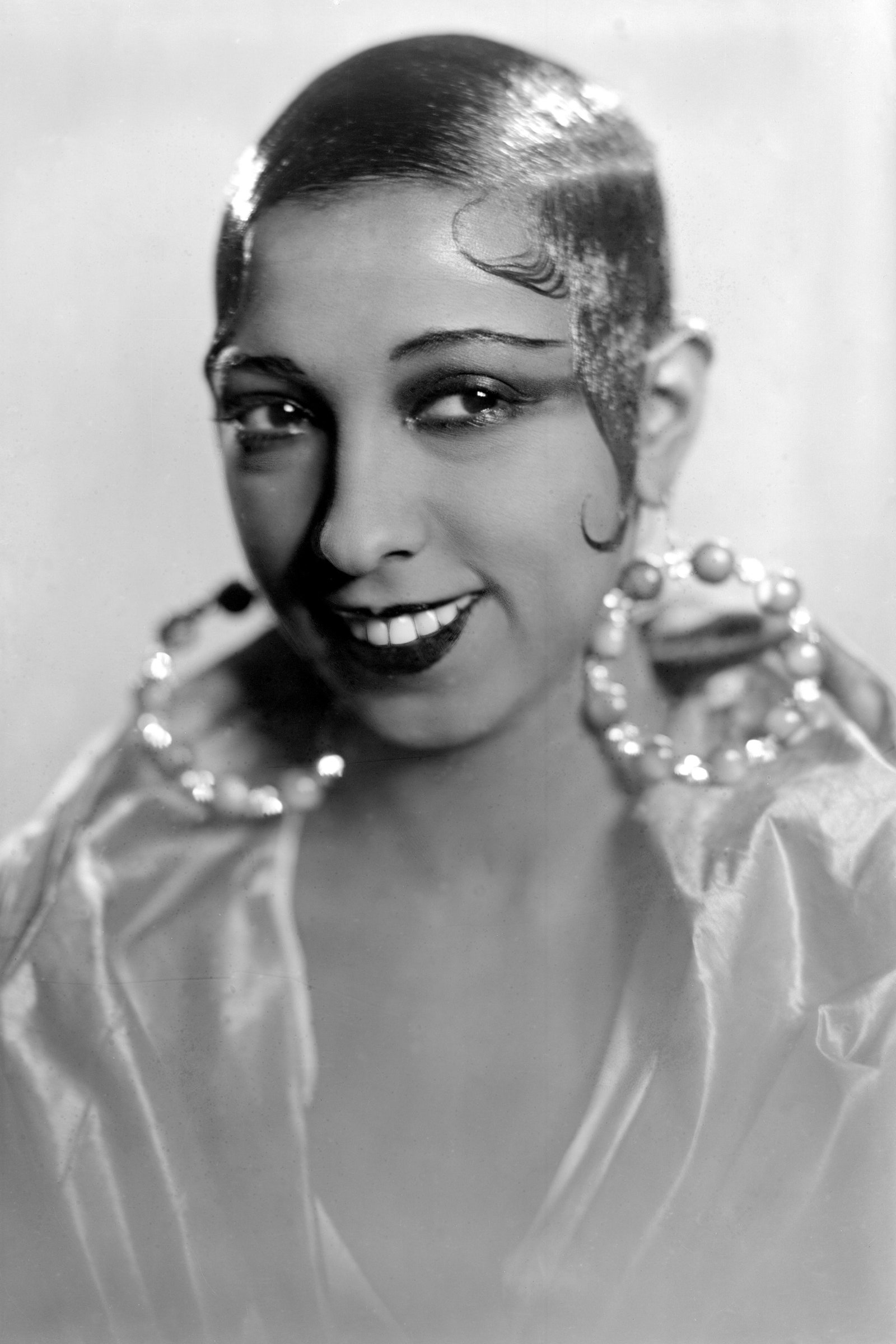 Image may contain Josephine Baker Human Person Face Accessories Accessory Finger and Jewelry Josephine Baker cat eye...