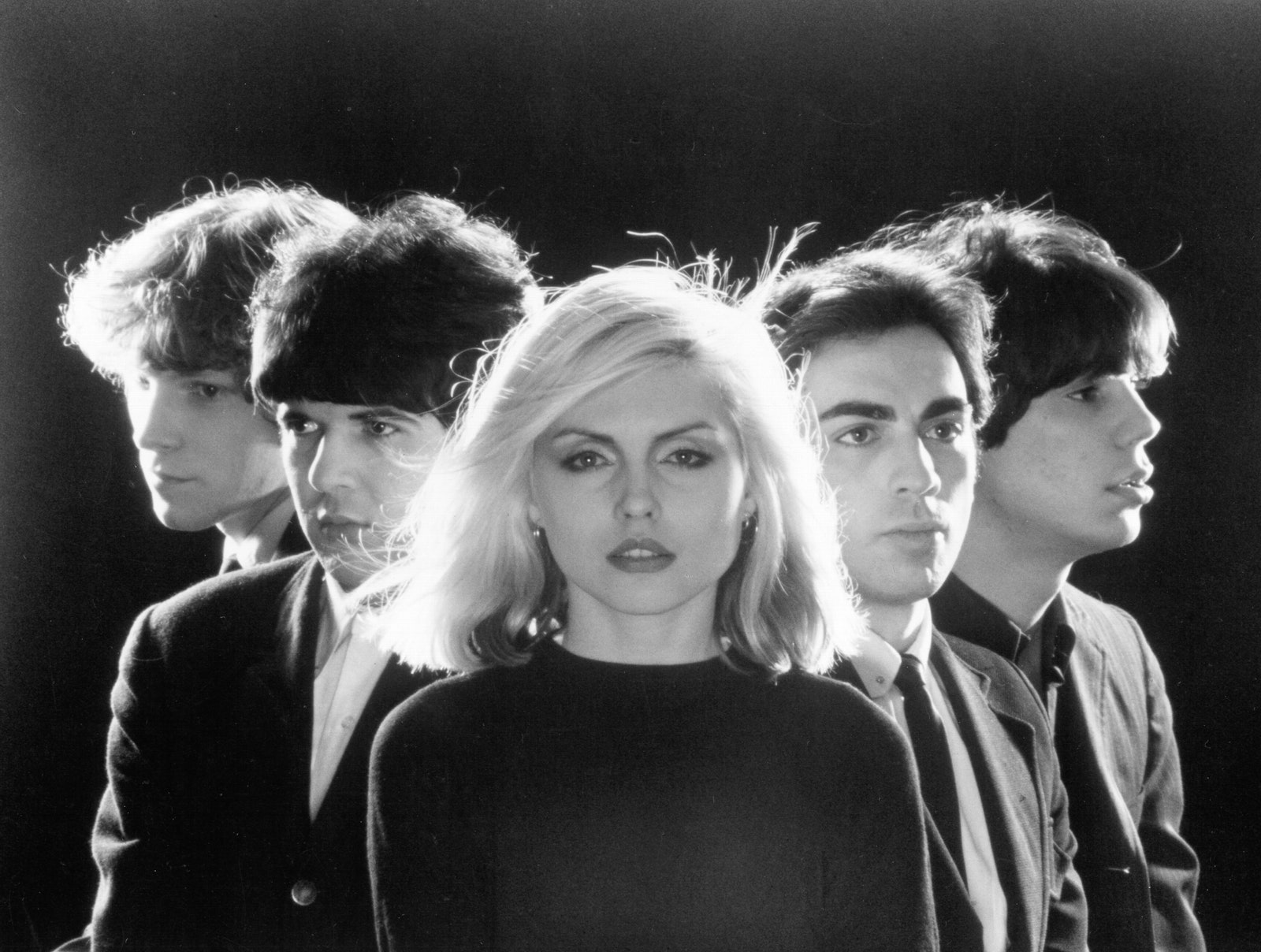 Image may contain Debbie Harry Human Person Clothing Apparel Face Crowd Suit Coat and Overcoat Debbie Harry Blondie cat...
