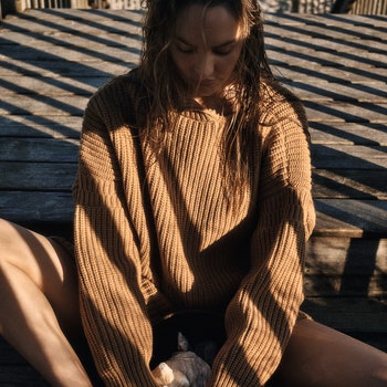 Model wearing brown coloured woolen dress