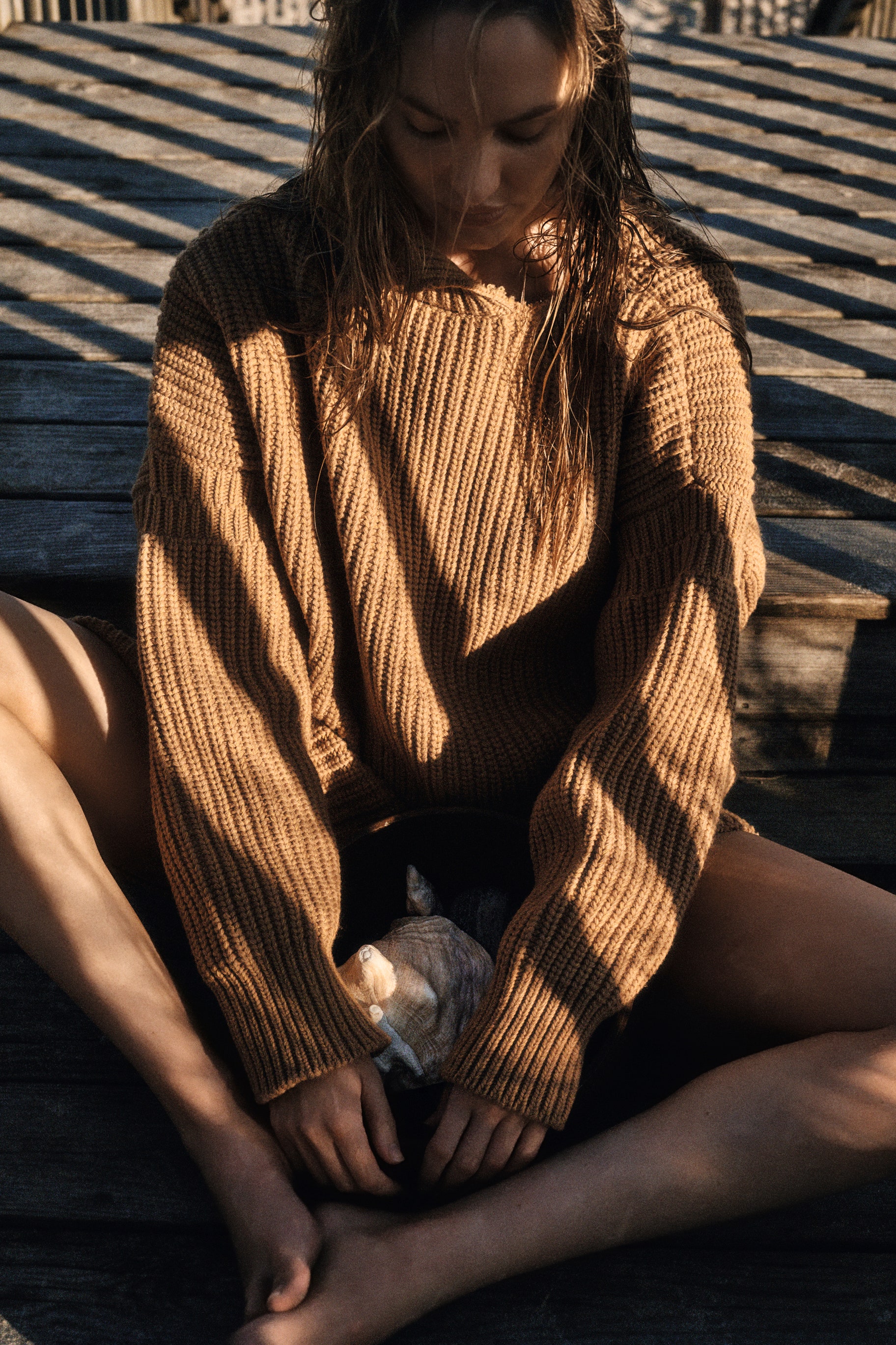 Model wearing brown coloured woolen dress
