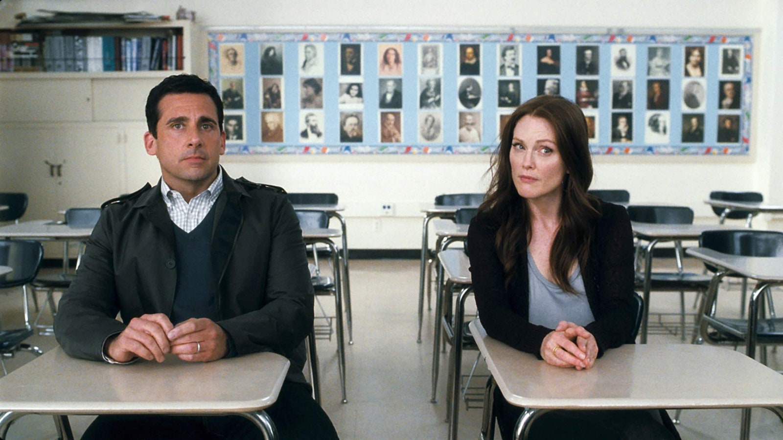 Image may contain Steve Carell Human Person Furniture Chair School Classroom Indoors Room Julianne Moore and Table