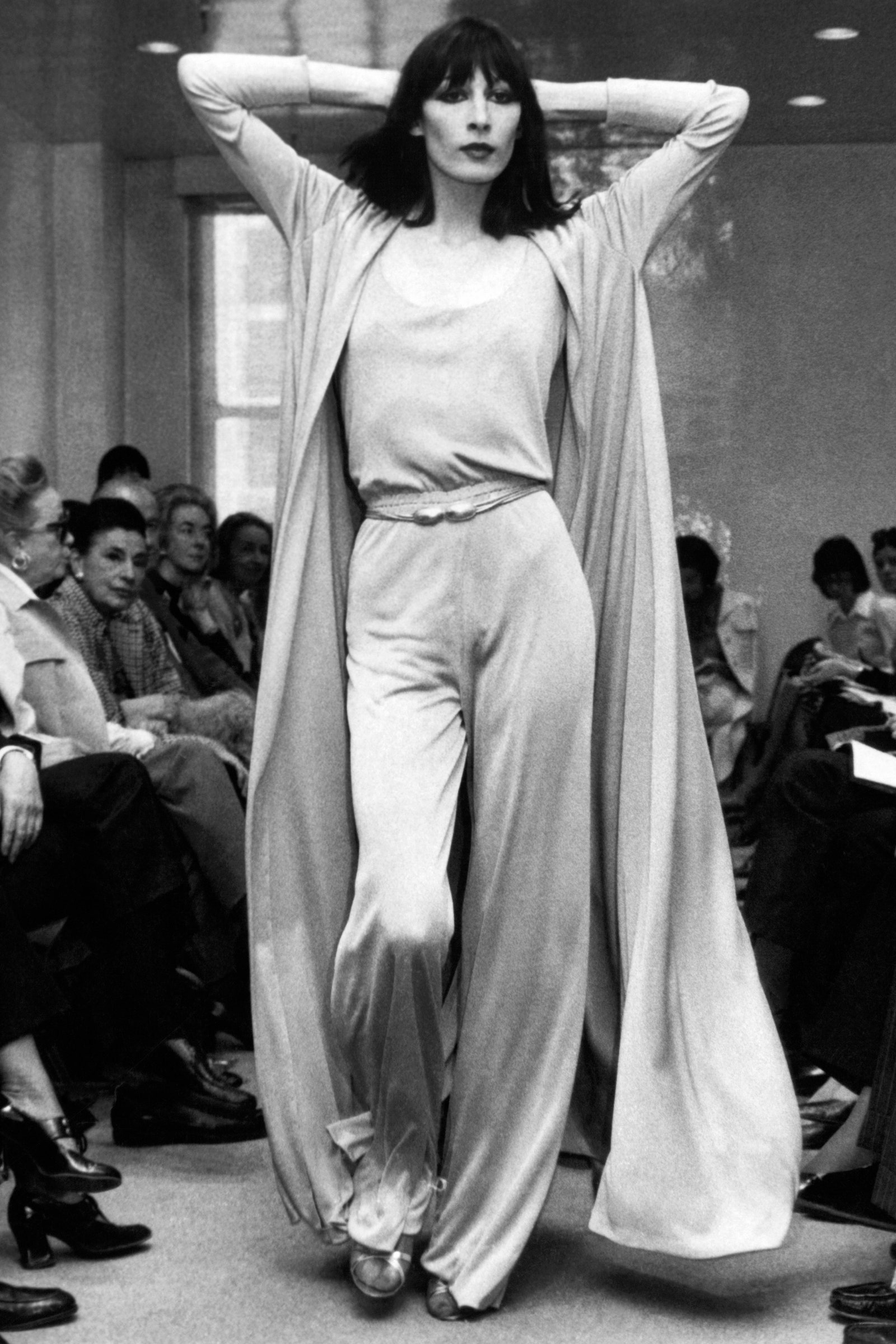 Image may contain Human PersonView of American fashion model and actress Angelica Huston dressed in a jersey evening...