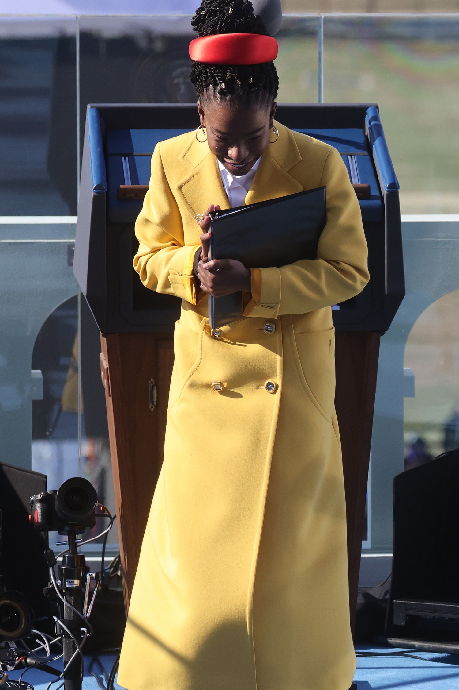 WASHINGTON DC  JANUARY 20 Amanda Gorman walks after she recited a poem during the inauguration of U.S. Presidentelect...