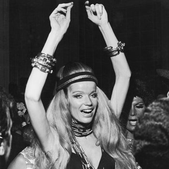 German countess and fashion model Veruschka raises her arms above her head as she dances at a party during Carnaval Rio...