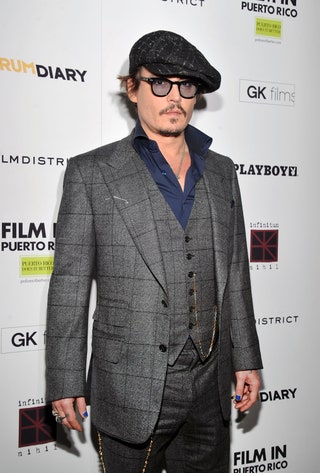 This image may contain Johnny Depp Clothing Apparel Suit Coat Overcoat Human Person Sunglasses and Accessories