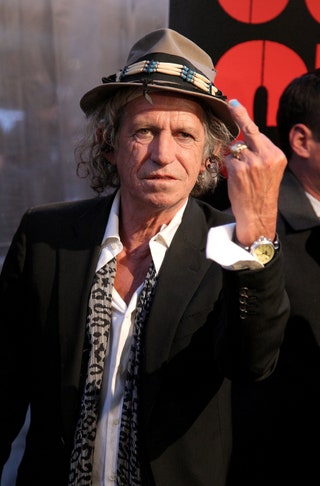 This image may contain Keith Richards Tie Accessories Accessory Suit Coat Clothing Overcoat Apparel and Human