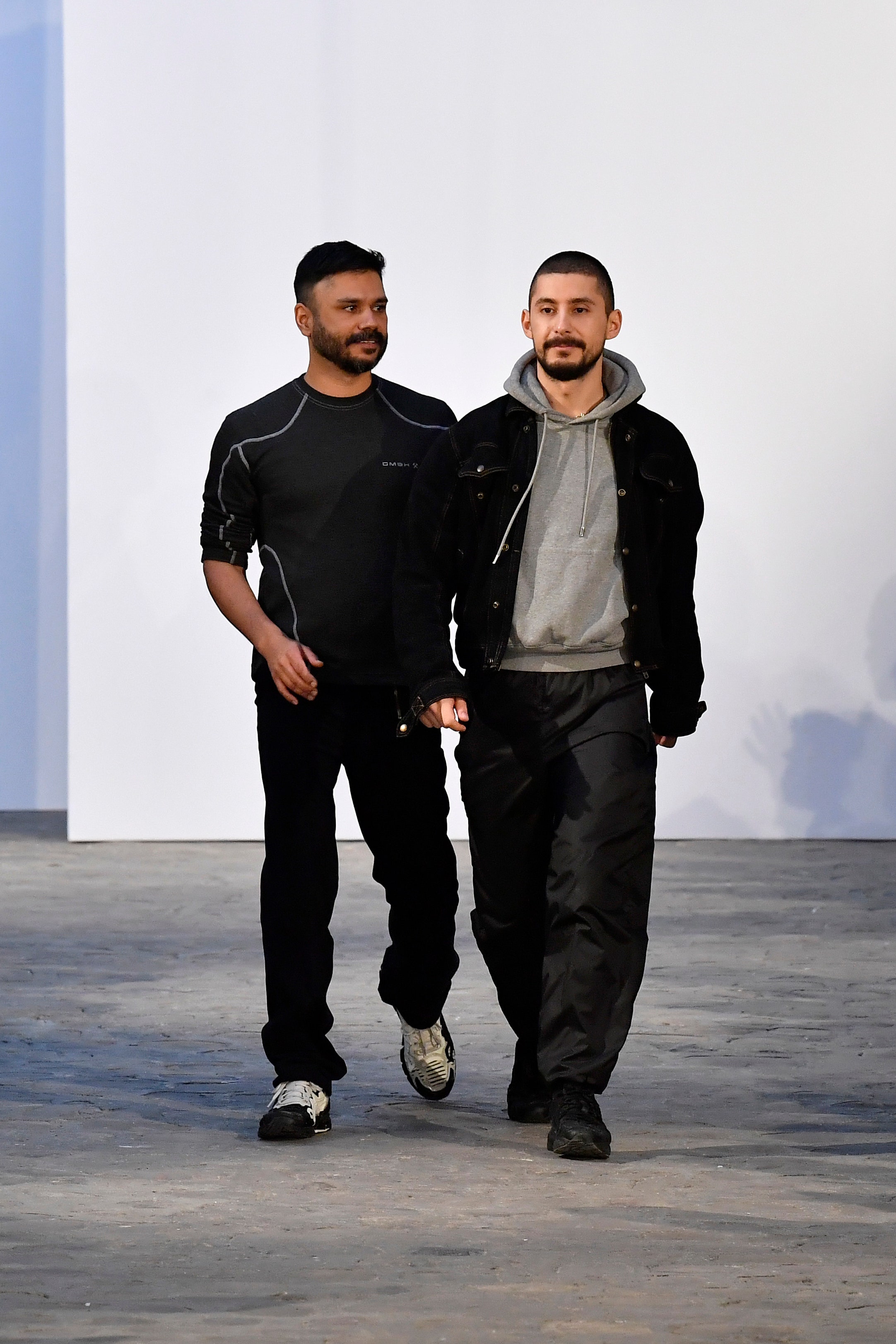 PARIS FRANCE  JANUARY 17  Designers Benjamin Huseby  Serhat Isik acknowledge the audience during the GMBH Menswear...