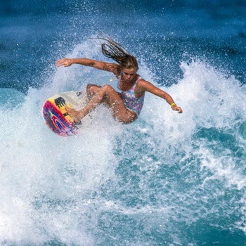 Wendy Botha  surfing Off The Wall on the North Shore of Oahu in Hawaii Photo joliphotos.com