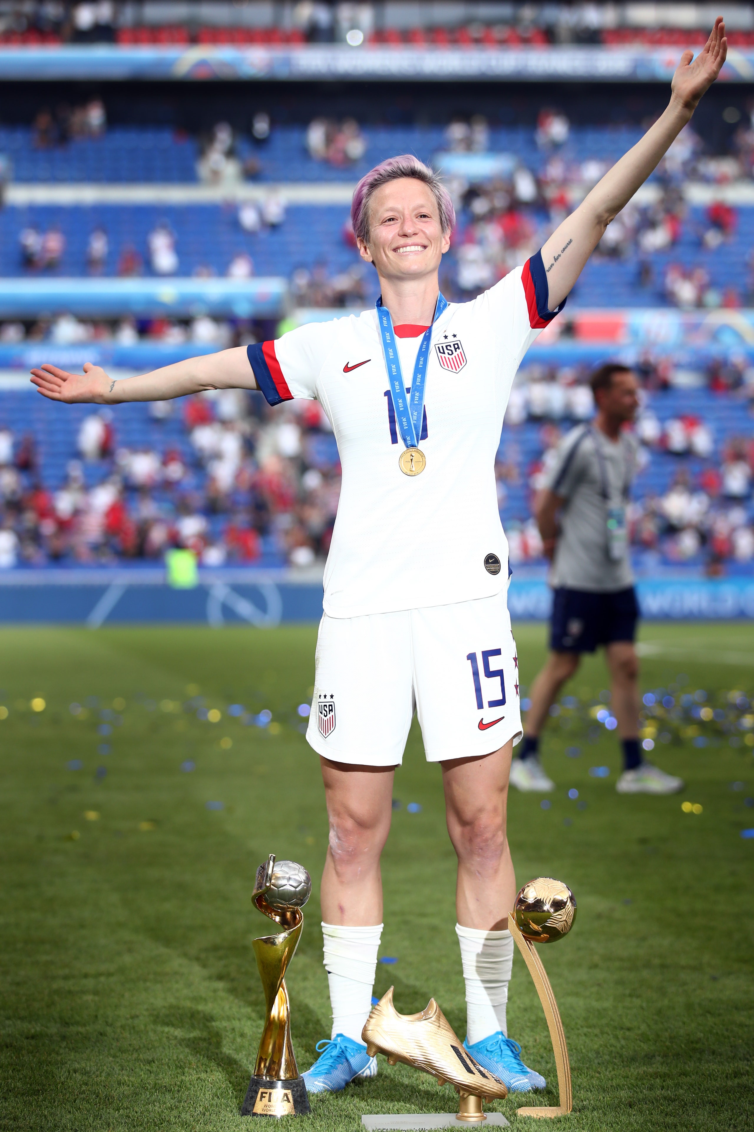 LYON FRANCE  JULY 07 Megan Rapinoe of the USA celebrates with the FIFA Women's World Cup Trophy the Golden Boot and The...