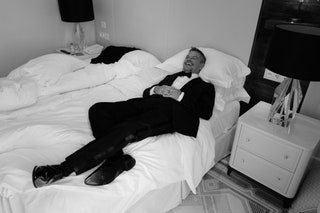Image may contain Matt Damon Furniture Bed Clothing Apparel Cushion Pillow Human Person and Interior Design