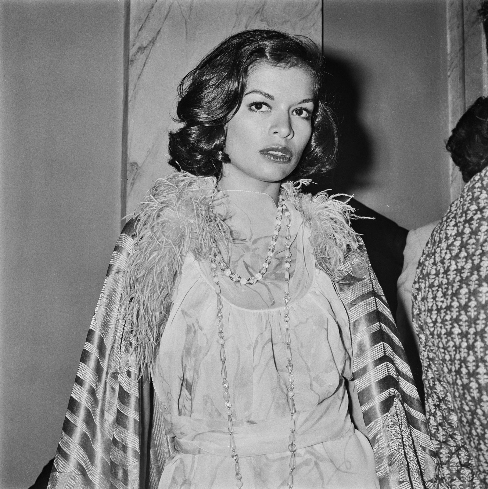 Image may contain Bianca Jagger Clothing Apparel Human Person Face Evening Dress Fashion Gown Robe and Sleeve