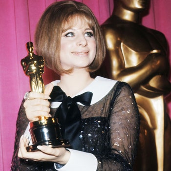Singer and actress Barbra Streisand holds her Oscar for Best Actress won for the performance as Fanny Brice in the...