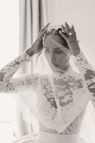 Image may contain Clothing Apparel Veil Human Person Fashion Robe Gown Karmen Pedaru Wedding and Lace