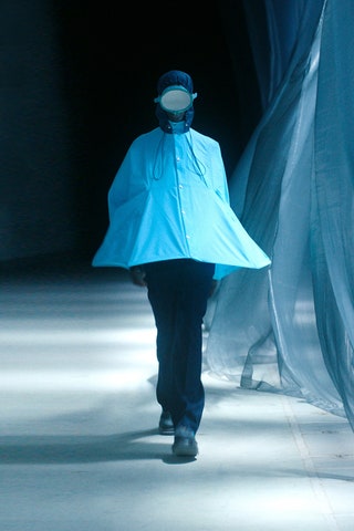 Image may contain Clothing Apparel Human Person and Coat