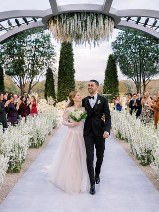 Image may contain Clothing Apparel Human Person Fashion Robe Wedding Gown and Wedding Gown