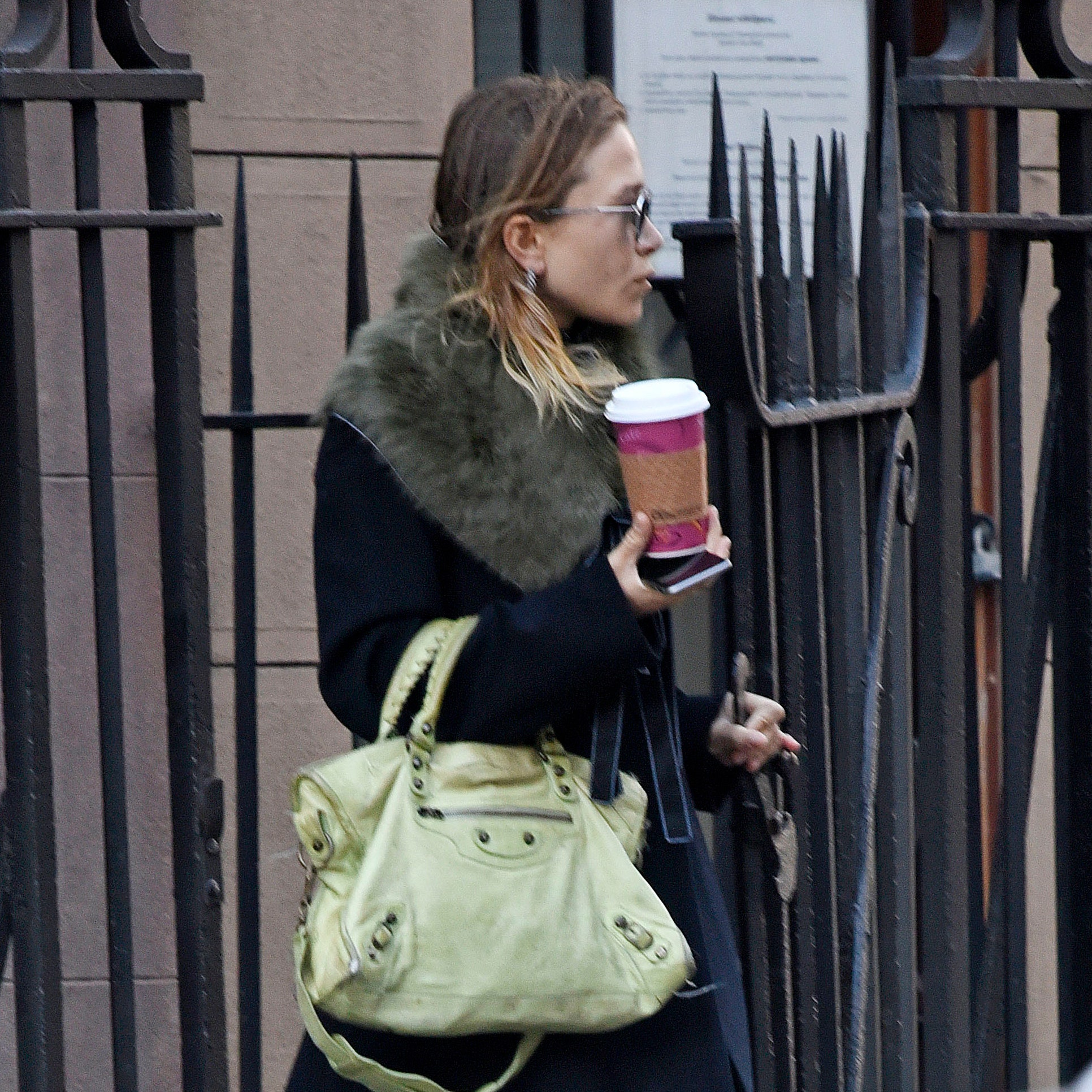 EXCLUSIVE Mary Kate Olsen wears a fur scarf and midcalf boots while out in New York City.Pictured Mary Kate OlsenRef...