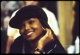 Image may contain Face Human Smile Person Hat Clothing Apparel Dimples and Janet Jackson