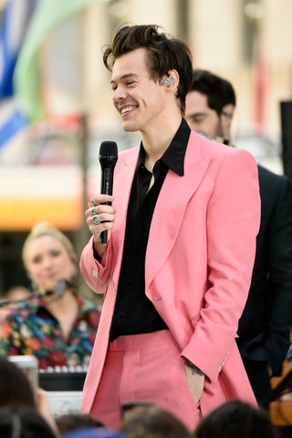 Image may contain Human Person Electrical Device Microphone Harry Styles Suit Coat Clothing Overcoat and Apparel