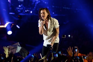 Image may contain Human Person Crowd Harry Styles Concert Rock Concert Musical Instrument Musician and Stage