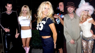 Image may contain Human Person Tommy Lee Pamela Anderson Clothing Apparel Musical Instrument and Guitar