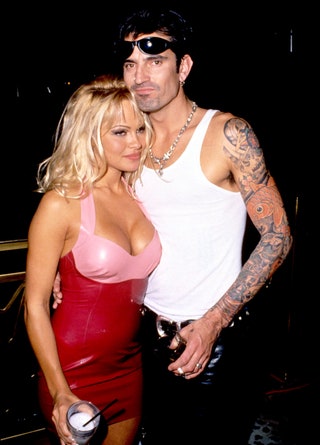 Image may contain Human Person Sunglasses Accessories Accessory Clothing Apparel Tommy Lee Pamela Anderson and Skin