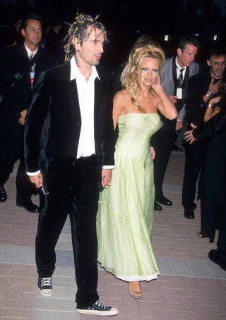 Image may contain Pamela Anderson Footwear Clothing Shoe Apparel Tommy Lee Human Person Fashion and Evening Dress