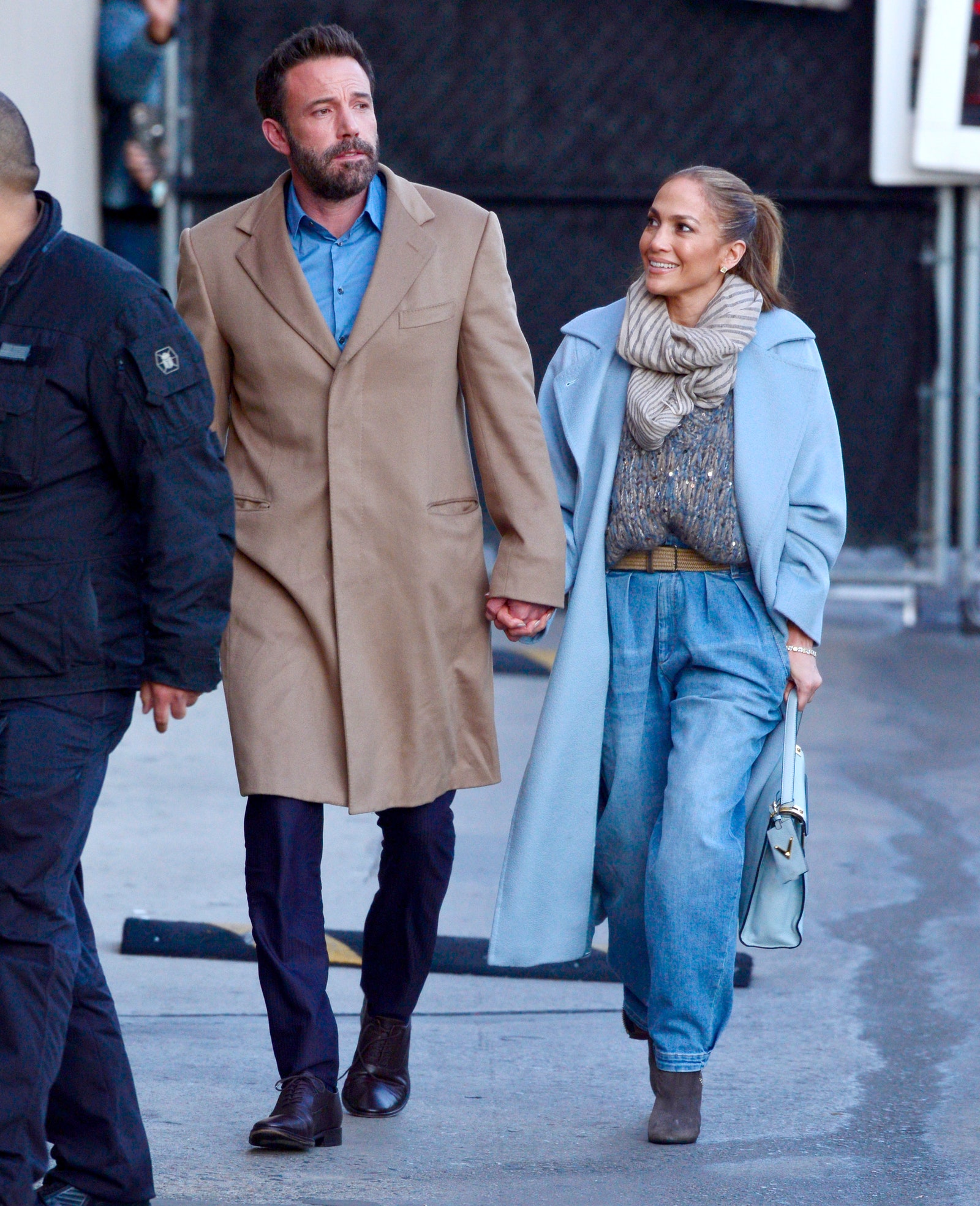 Image may contain Clothing Apparel Coat Jennifer Lopez Human Person Footwear Shoe Pants Ben Affleck and Overcoat