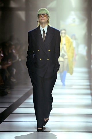 Image may contain Tie Accessories Accessory Suit Coat Clothing Overcoat Apparel Human Person Jacket and Blazer