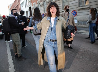 Image may contain Clothing Apparel Footwear Shoe Human Person Coat Overcoat Jacket Pants and Pedestrian